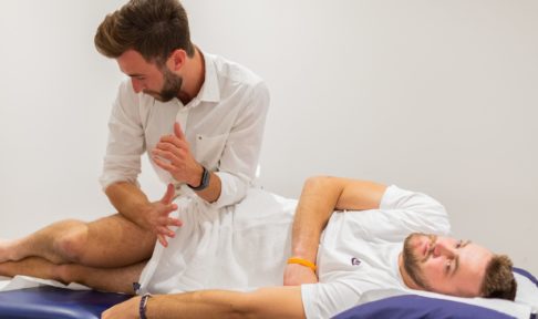 Physiotherapist treating patient